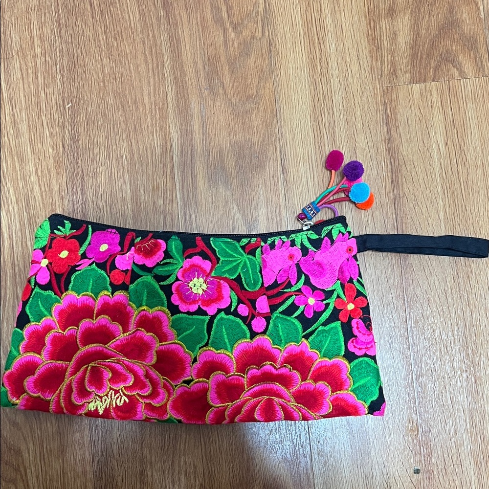 Made in Thailand zip up pouch. Never used